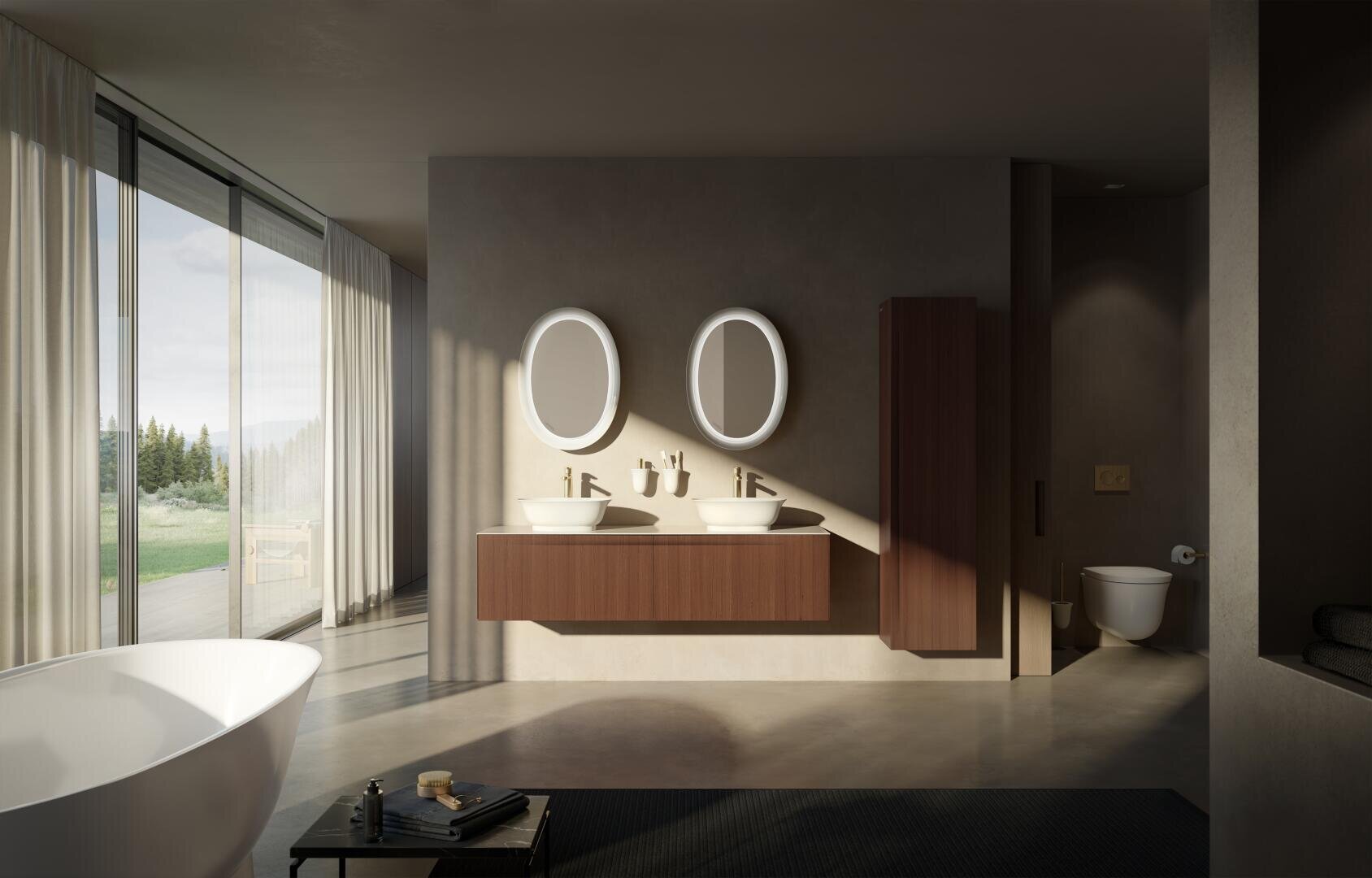 Salle de bains moderne avec des miroirs ovales au-dessus de deux lavabos, un lavabo en bois flottant, une baignoire sur pied, des fenêtres du sol au plafond avec des rideaux transparents et un espace séparé pour les toilettes. La pièce est inondée de lumière naturelle.