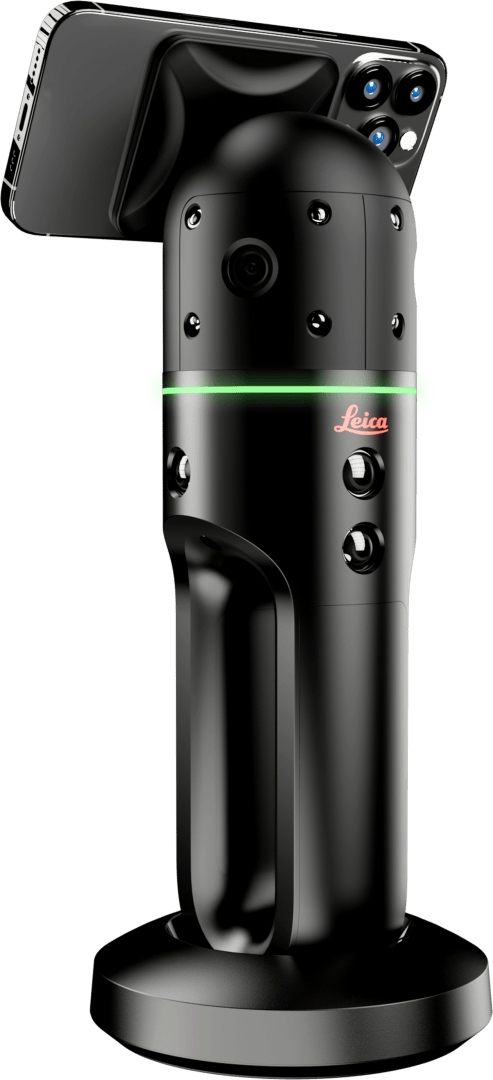 Ein schwarzes Leica 3D-Scangerät mit einem grünen LED-Ring und mehreren Sensoren, auf dem ein Smartphone aufrecht auf einer runden Basis steht.