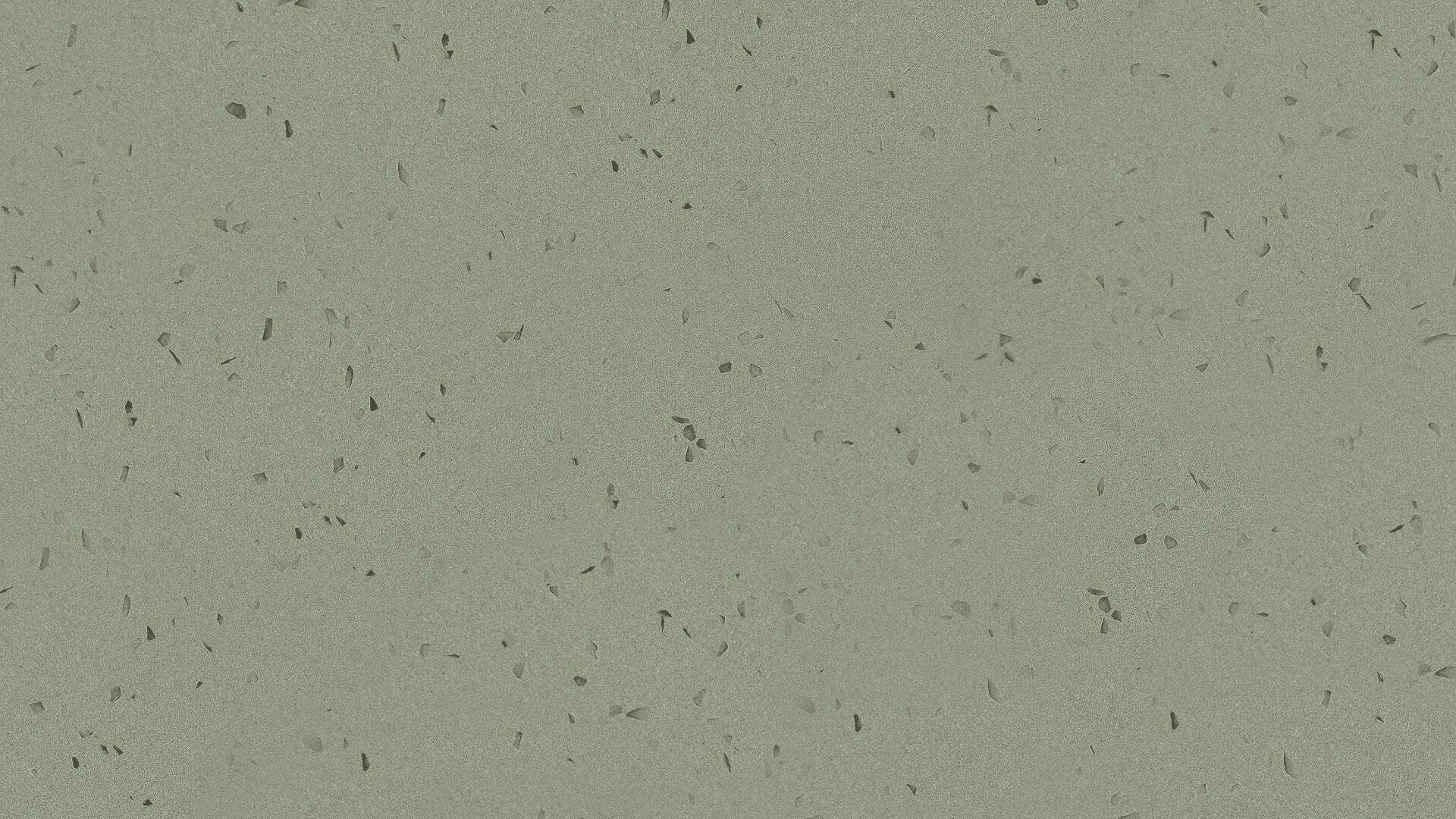 Hellgrüne gesprenkelte Oberfläche, die mit kleinen, unregelmäßigen dunklen Flecken durchsetzt ist und einem Terrazzo- oder Vinylbodenmuster ähnelt.